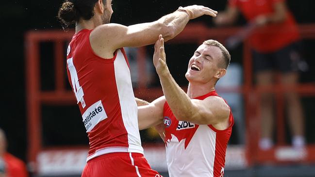 Sydney's Chad Warner celebrates kicking a goal  with Sydney's Brodie Grundy during the AFL practice match between the Sydney Swans and GWS Giants at Tramway Oval on February 21, 2024. Photo by Phil Hillyard(Image Supplied for Editorial Use only - **NO ON SALES** - Â©Phil Hillyard )