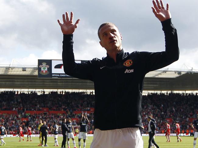 Manchester United's Nemanja Vidic waves to the supporters at the end of their English Premier League soccer match against Southampton at St Mary's stadium, Southampton, England, Sunday, May 11, 2014. (AP Photo/Sang Tan)