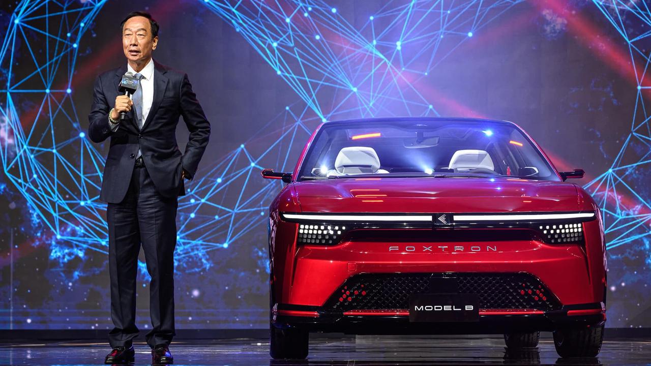 Foxconn founder Terry Gou with its electric Model B concept.