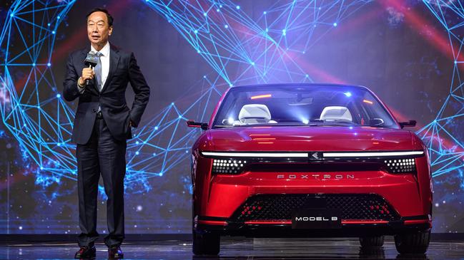 Foxconn founder Terry Gou with its electric Model B concept.