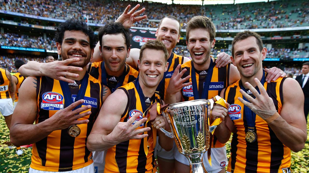 Rioli, left, and Mitchell, centre, won four flags together. Picture: Wayne Ludbey