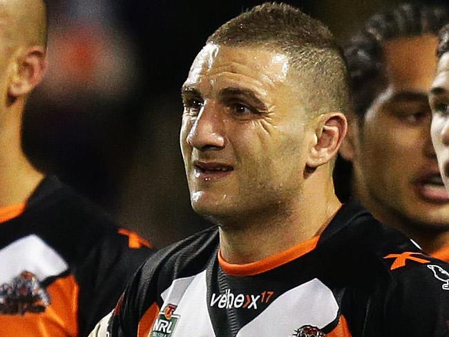 Tigers Robbie Farah and his team look on after a Melbourne try during the Wests Tigers v Melbourne Storm rugby league game at Campbelltown Stadium, Sydney. Pic Brett Costello