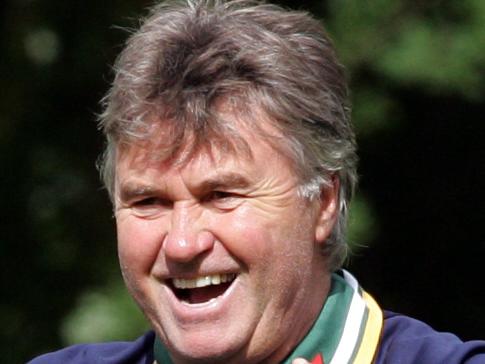 Socceroos coach Guus Hiddink celebrates after he hit crossbar in competition with other coaches for a bottle of wine during Australia team World Cup 2006 training session while in camp in Mierlo, The Netherlands, 29/05/06, before heading off for finals in Germany.