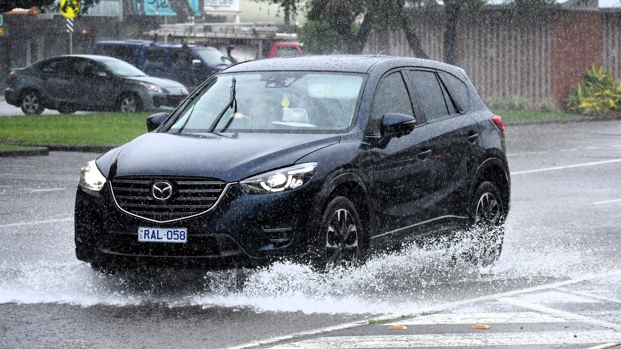 Heavy rain falling in Lannercost St in the Ingham CBD on Tuesday as a moderate flood warning was issued for the Herbert River. Picture: Cameron Bates