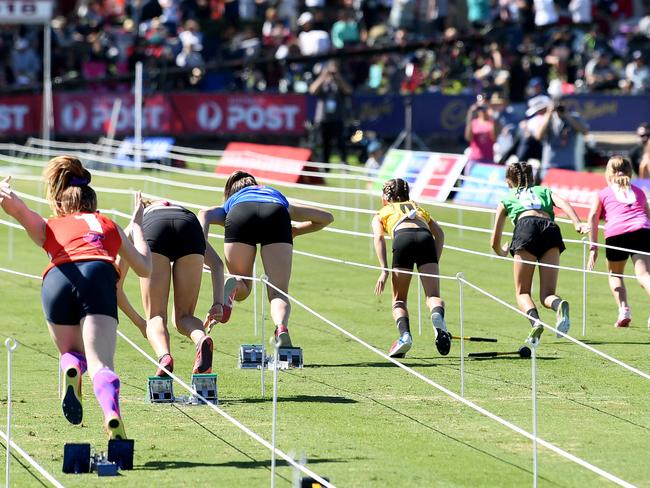 Runners take off in the Semis of the Little Athletic Girls 100m during the 2018 Stawell Gift in Central Park, Stawell, Victoria, Monday, Monday, April 2, 2018. (AAP Image/Joe Castro) NO ARCHIVING, EDITORIAL USE ONLY