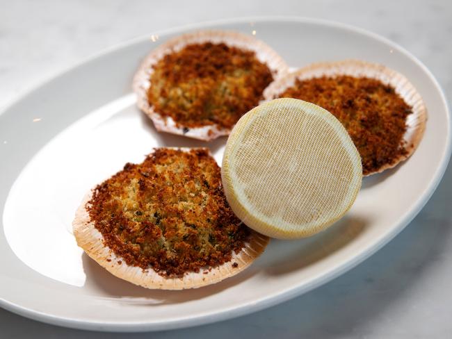 Scallops buried beneath buttery parmesan breadcrumbs are a great snack at Di Stasio Citta.