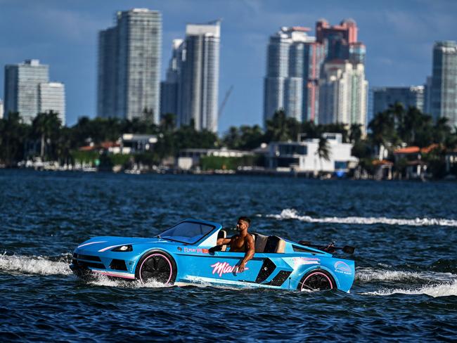 A man cruises in a modified boat ‘Jetcar’ in the bay in Miami, Florida. Picture: Chandan Khanna/AFP