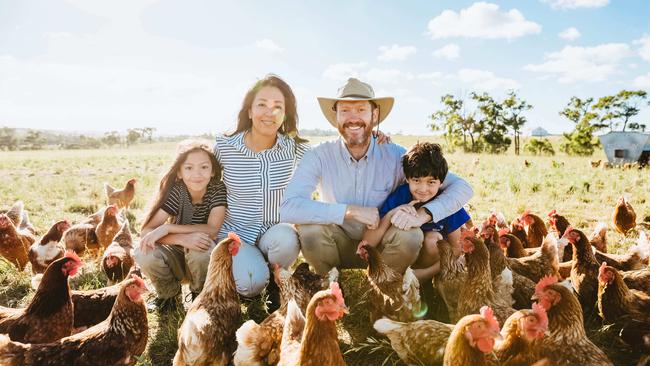 Kelvin and Kumi Slade on their farm at Willow Grove with their sons Dhiira and Manan. Picture: Chloe Smith