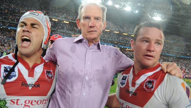 St. George Illawarra Dragons' coach Wayne Bennett (centre) with Jamie Soward (left) and Dean Young celebrate their teams win over Sydney Roosters during the NRL Grand Final at ANZ Stadium, Sydney, Sunday, Oct. 3, 2010.