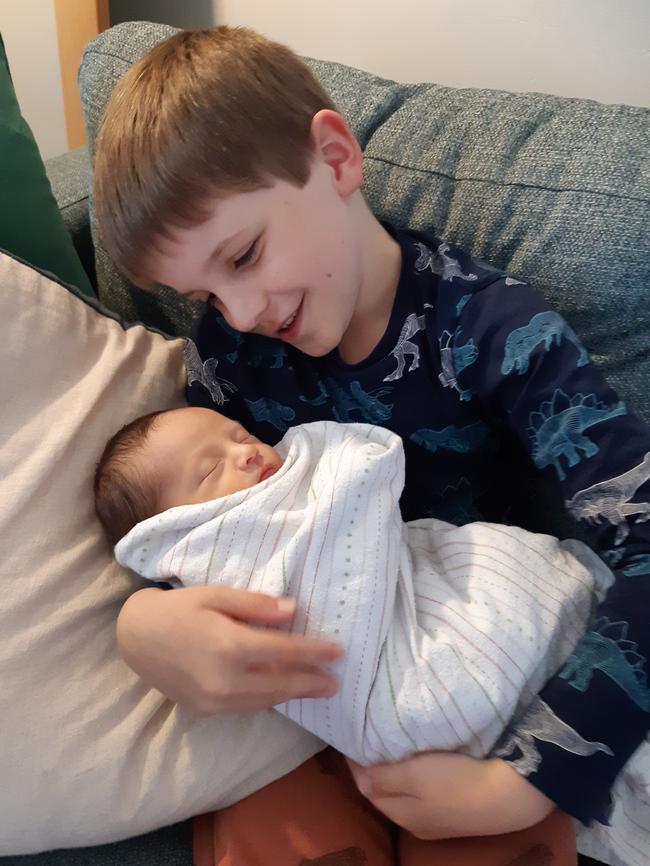 Finley D'Arcy, 7, holding baby Till Barnett. Picture: Supplied.