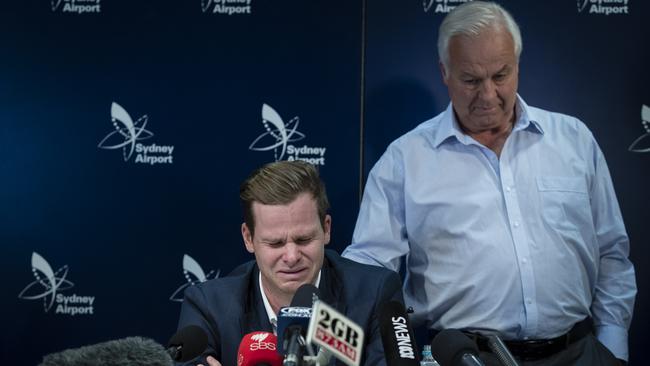 Steve Smith’s father Peter comforts his son during Smith’s emotional press conference at Sydney Airport last year. Picture: Getty Images