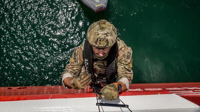 EMBARGOED 27TH OCTOBER WARNING WARNING FOR SUNDAY HERALD SUN ONLY - ONE TIME USE ONLY CANNOT BE USED FOR ANY OTHER PURPOSE DO NOT USE,  The Special Operations Group (SOG) conducts a high-level training exercise on the Spirit of Tasmania. SOG personnel scale a ladder before entering the ship. Picture: Jake Nowakowski