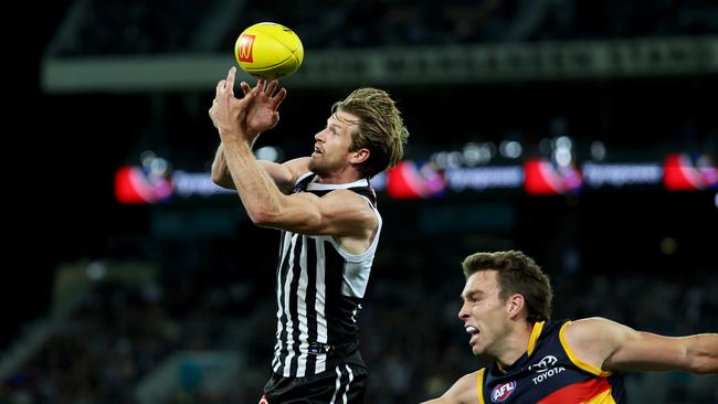 Tom Jonas of the Power clashes with Riley Thilthorpe. Picture: James Elsby/AFL Photos