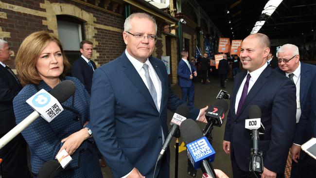 Liberal Member for Corangamite Sarah Henderson, Prime Minister Scott Morrison and Treasurer Josh Frydenberg announce a high-speed rail link between Melbourne and Geelong. Picture: AAP 