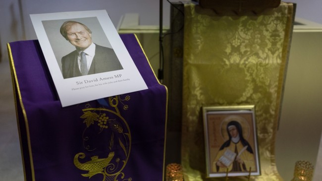 A tribute to Sir David Amess is displayed during a vigil at St Peter's Catholic Church. Picture: Getty Images