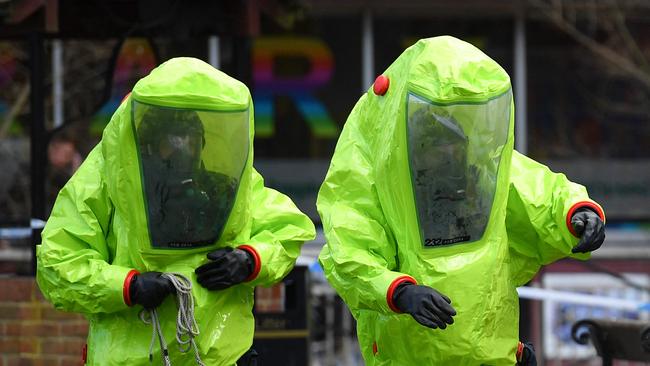 Members of the emergency services in green biohazard encapsulated suits in Salisbury, southern England, on March 8, 2018. Picture: AFP / Ben Stansall