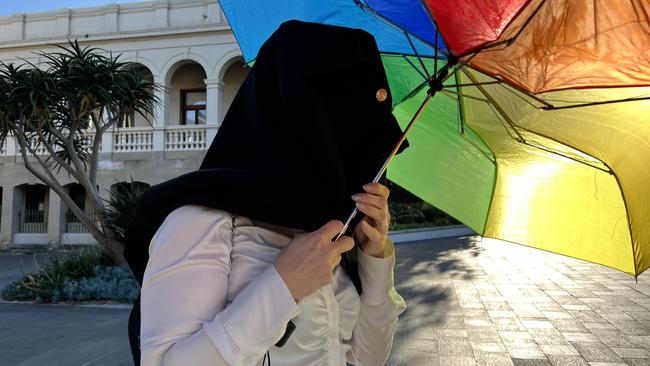 Shayne Louise Freimann was completely covered up leaving Wollongong Courthouse on Monday. Picture: Dylan Arvela