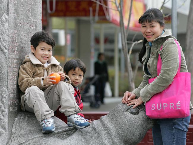 Srey Chea with her kids Anton, 4, and Winston, 3, in Freedom Plaza in 2005. Picture: Dean Marzolla