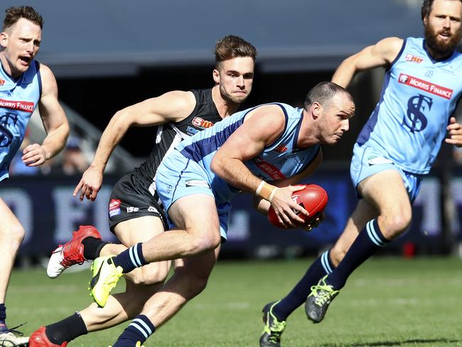 SANFL - Grand Final - Port Adelaide v Sturt at Adelaide Oval. Zane Kirkwood runs forward with Will Snelling in pursuit. Picture Sarah Reed