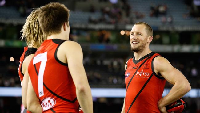 James Kelly celebrates the win with Dyson Heppell and Zach Merrett. Picture: Getty Images