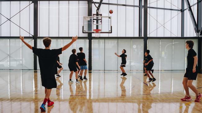 Shoot hoops with mates at Hoops Capital Academy.