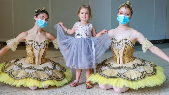 Sophia, 4, with ballerinas from the Australian Ballet School. Picture: Ian Currie