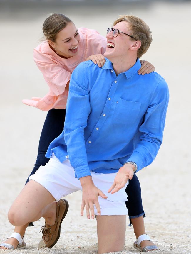 Swimming champion Mack Horton and his girlfriend Ella Walter on the beach before the Commonwealth Games in April. Picture: Alex Coppel