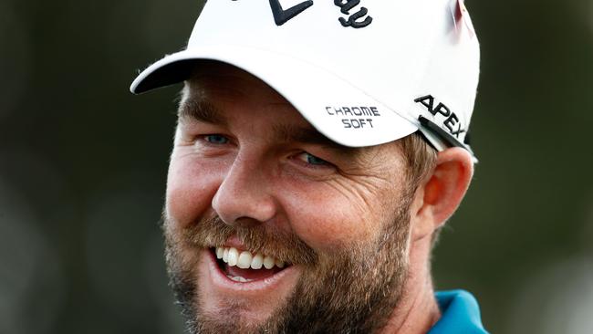 Marc Leishman smiles during the trophy presentation.