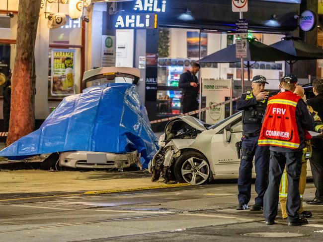 The scene of the fatal crash on the corner of Bourke St and Russell St. Picture: Jake Nowakowski