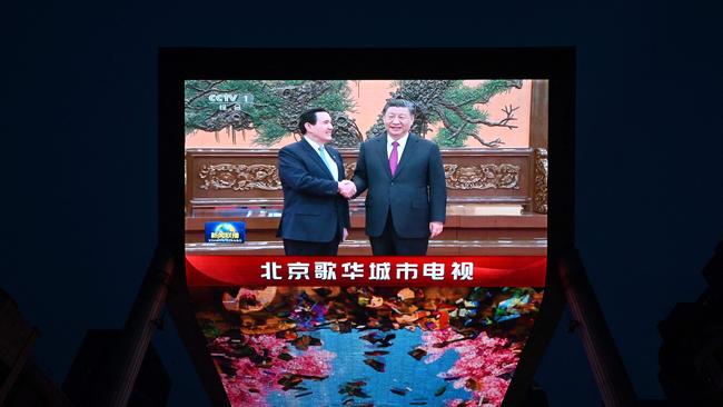 A large screen shows news coverage of Chinese President Xi Jinping meeting former Taiwan president Ma Ying-jeou in Beijing this week. Picture: AFP