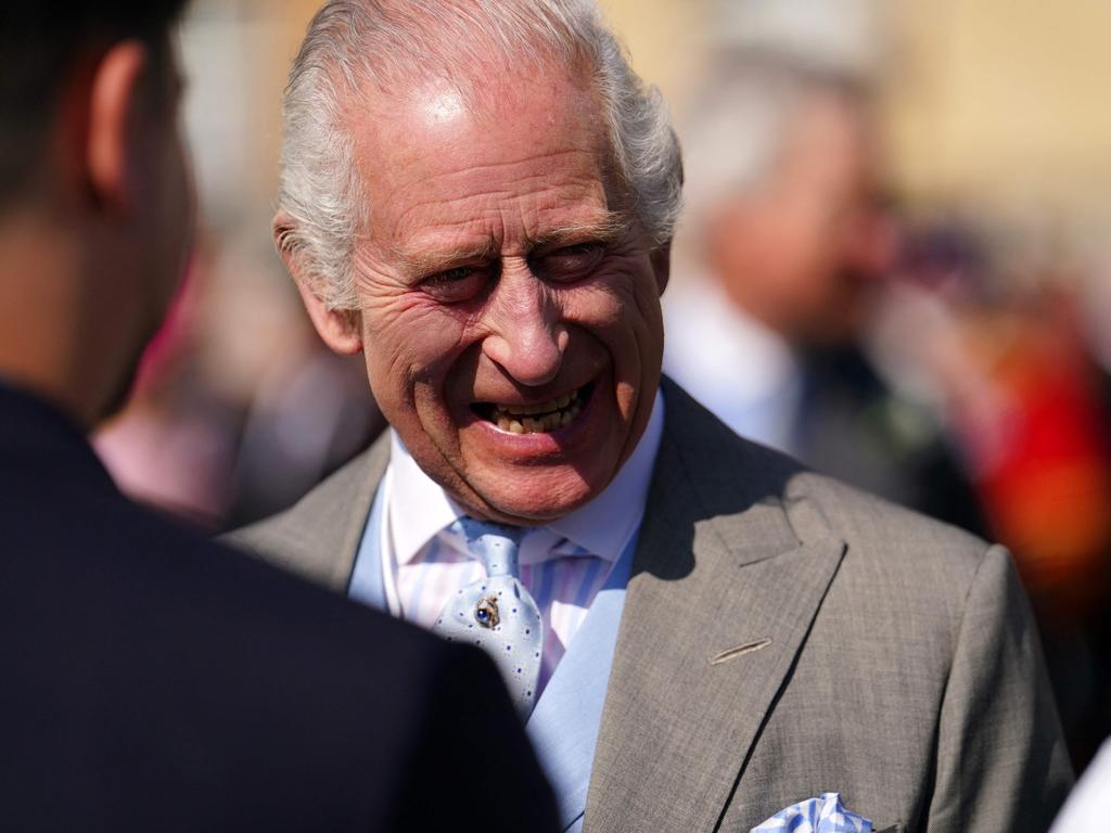 King Charles was all smiles as he hosted a Royal Garden Party at Buckingham Palace. Picture: AFP