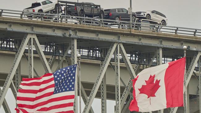 A truck with vehicles crosses the Blue Water Bridge border crossing into the US from Ontario, Canada. Picture: AFP