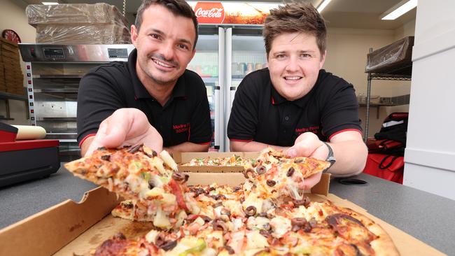 Merlins Pizza has been named the best on the Gold Coast. Co-owners Jordan Powell and Scott Jelich with some of their tasty treats. Picture Glenn Hampson