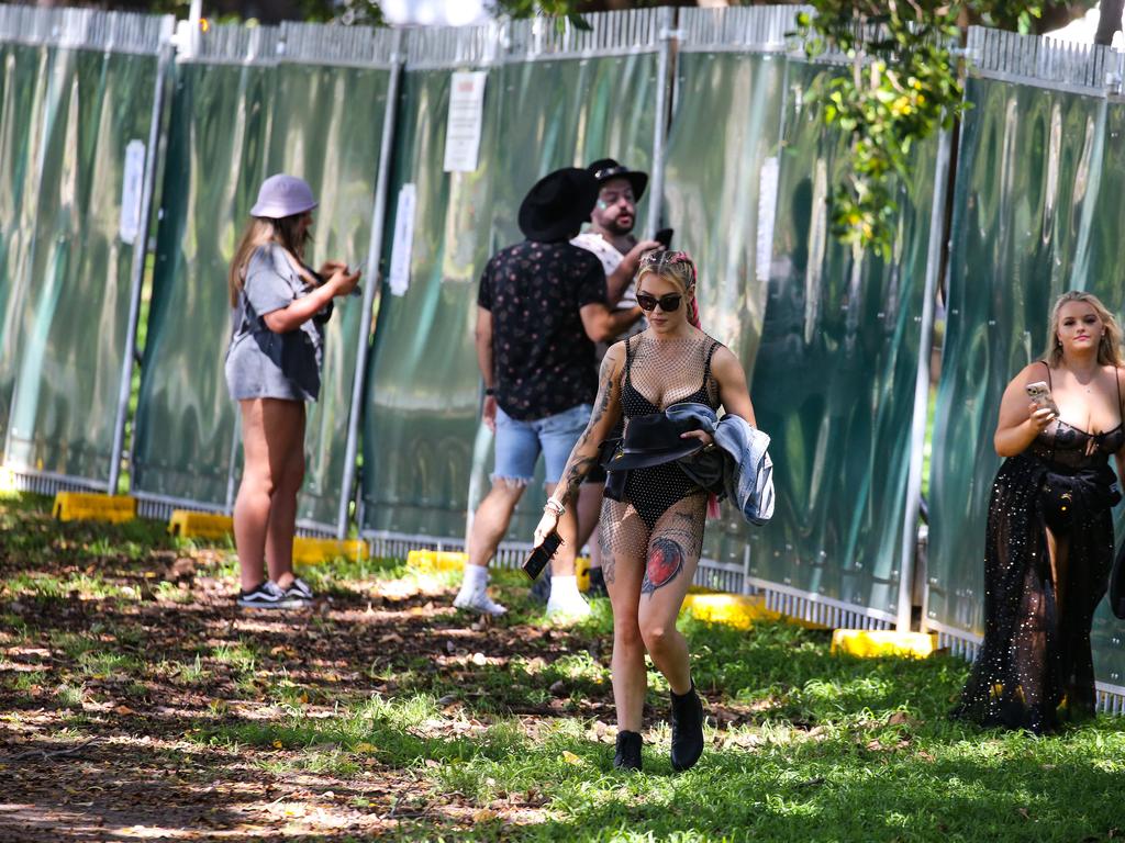 Sydneysiders are seen arriving for the Field Day Music Festival at the Domain in Sydney on New Year’s Day.