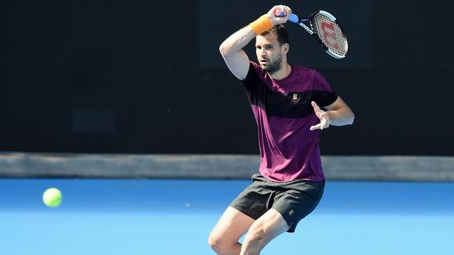 Grigor Dimitrov having a hit at Melbourne Park. Picture: Lawrence Pinder