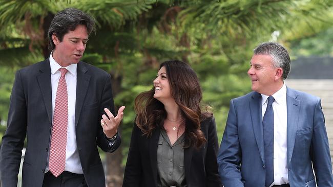 AFL boss Gillon McLachlan with the league’s head of mental health and wellbeing Dr Kate Hall and Lifeline Australia boss Colin Seery.