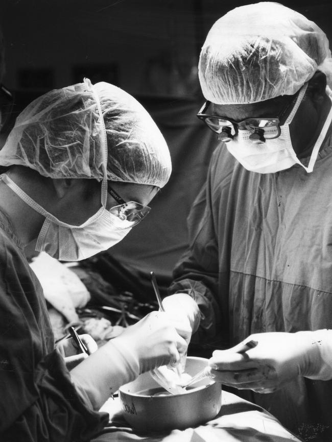 Dr Mohan Rao, right, working at the Queen Elizabeth Hospital in the 90s.