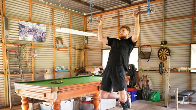 Shaun Atley works out in the farm’s gym. Picture: AAP Image/Michael Dodge