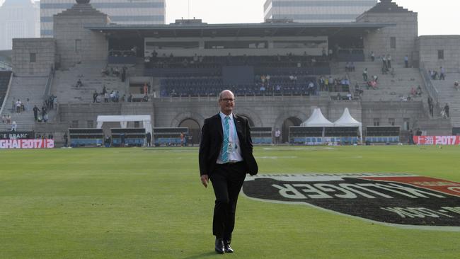 Port Adelaide president David Koch walks across the field after their win against the Gold Coast Suns in 2017 at Jiangwan Stadium in Shanghai, China. Picture: Tracey Nearmy/AAP