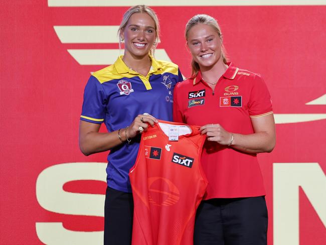 Havana Harris (Gold Coast Suns Academy, QLD) (L) poses with Charlie Rowbottom of the Suns. (Photo by Dylan Burns/AFL Photos via Getty Images)