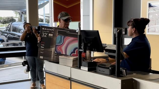 Aldi Andergrove's first official customer was this gentleman, who made a beeline for the TVs and was out in less than five minutes. Photo: Fergus Gregg