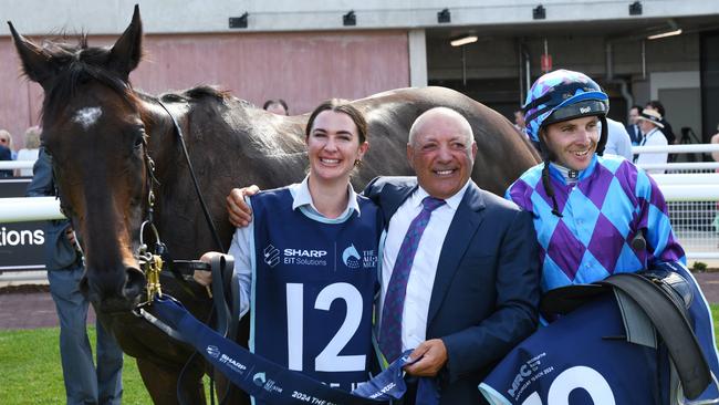 MELBOURNE, AUSTRALIA - MARCH 16: Declan Bates poses with owner Tony Ottobre after Pride of Jenni won Race 8, the The Sharp Eit All-star Mile, during The All-Star Mile Race Day at Caulfield Racecourse on March 16, 2024 in Melbourne, Australia. (Photo by Vince Caligiuri/Getty Images)