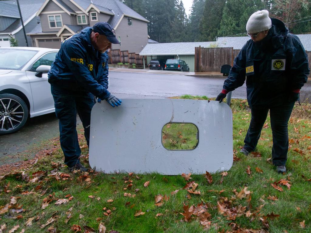 Authorities inspect the door plug from an Alaska Airlines plane that fell to the ground in Portland, Oregon. Picture: AFP