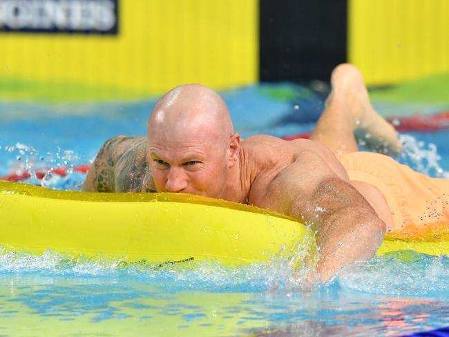 Former Sydney Swans player, Barry Hall, during a celebrity swimming race  on day three of swimming competition at the XXI Commonwealth Games at Gold Coast Aquatic Centre on the Gold Coast, Australia, Saturday, April 7, 2018. (AAP Image/Darren England) NO ARCHIVING, EDITORIAL USE ONLY