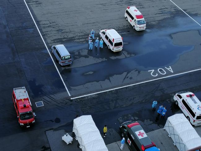 Ambulances at Yokohama as seen from the Diamond Princess cruise ship.