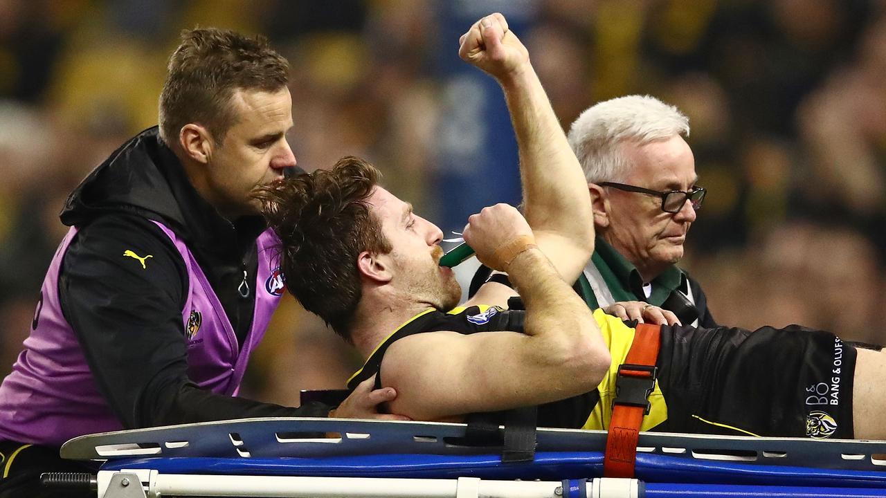 Reece Conca leaves the field injured during Richmond’s win over Sydney. (Photo by Scott Barbour/Getty Images)