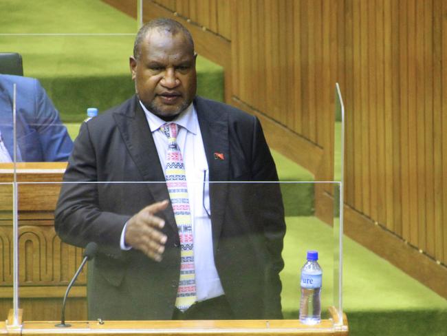 Papua New Guinea's Prime Minister James Marape speaks in parliament after he was sworn in for his second term as prime minister in Port Moresby on August 9, 2022. - Marape was sworn in for a second term on August 9, after an election hit by violence and alleged corruption that also ended a five-year absence of women in parliament. (Photo by Andrew Kutan / AFP)