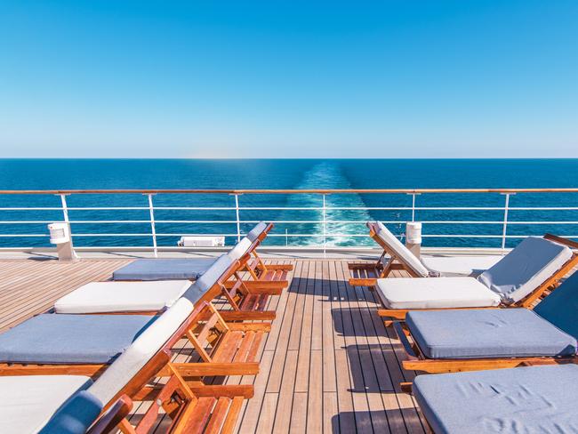 Cruise Ship Vacation. Sea Travel Concept with Deckchairs on the Vessel Deck.