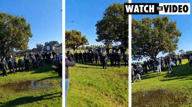 Wall of police tell anti-lockdown protesters to move on