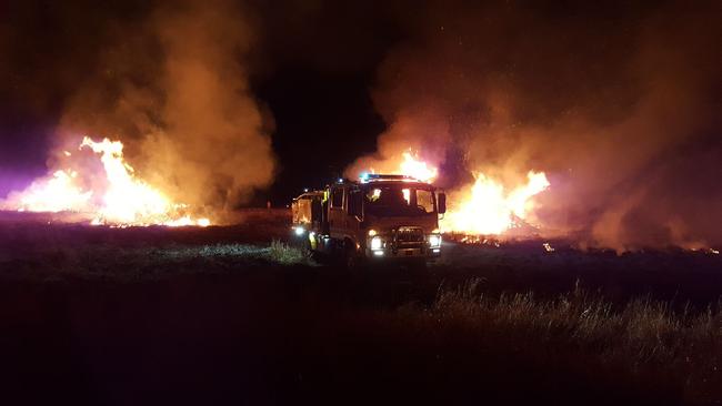 The battle to contain the blaze at Kilkivan, west of Gympe. Picture: Denis Chapman